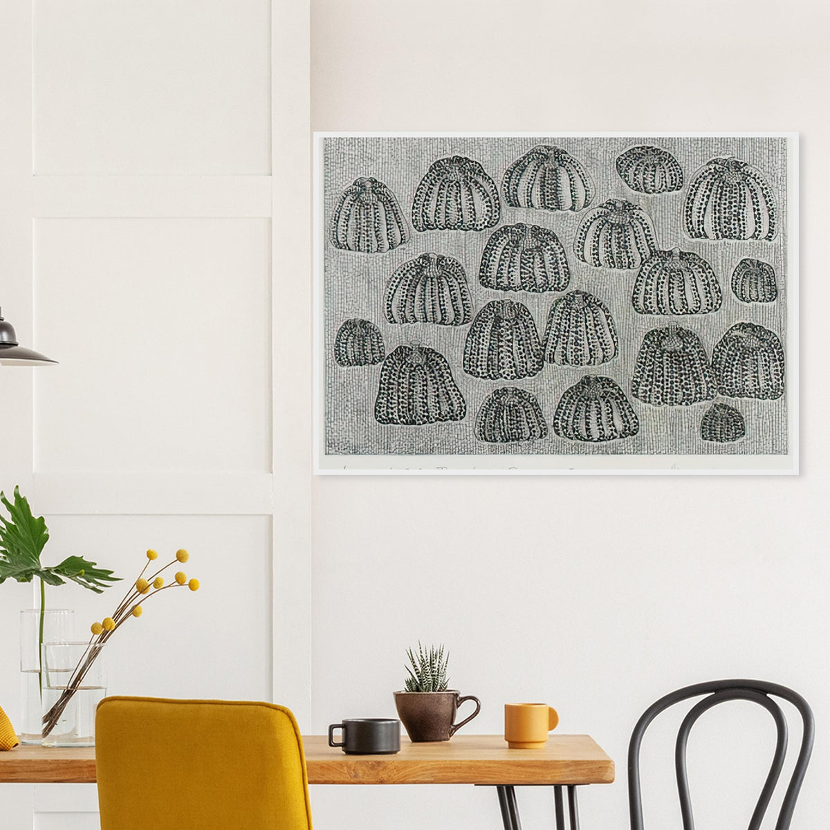 Yayoi Kusama framed print — Pumpkin Army (black and white) turns a single familiar vegetable into a collective presence