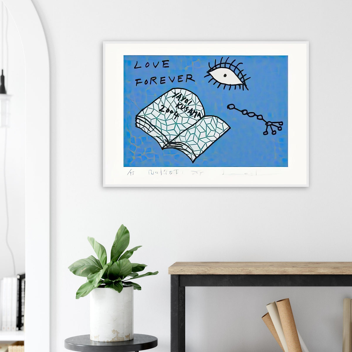 Yayoi Kusama framed print — Book to Read at Night D places an illustrated book at the center of a strange, poetic visual world
